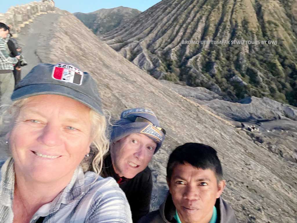 Bromo Ijen Tumpak Sewu tour review happy traveler at Mount Bromo sunrise viewpoint